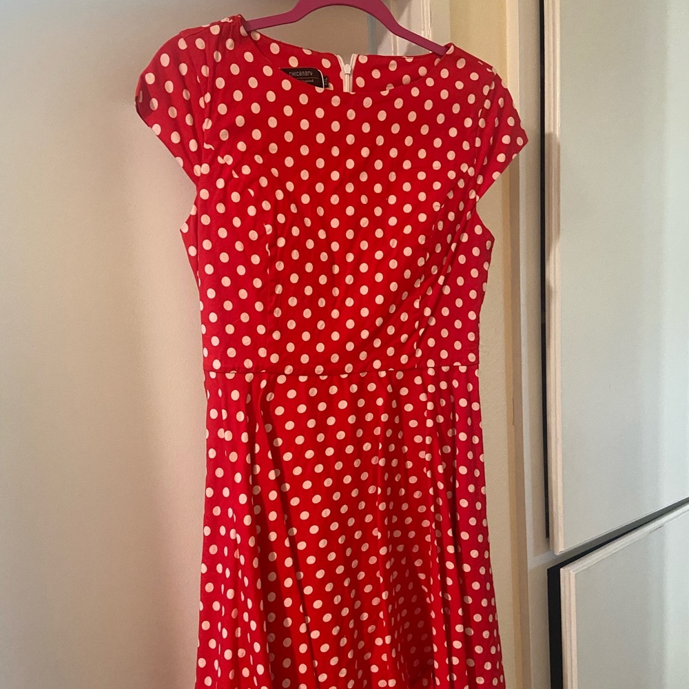 Knee-length red polka dot dress